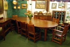 Gustav Stickley 60 in. 5-leg dining table & 10 v-back dining chairs with original leather & pyramid tacks .